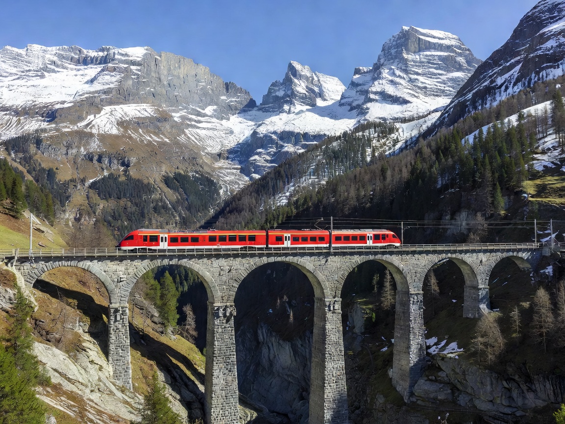 Bernina Express train crossing landwasser viaduct in Switzerland